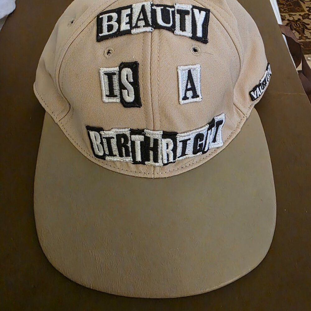 Valentino cap beauty is a birthright tan brand new with tags